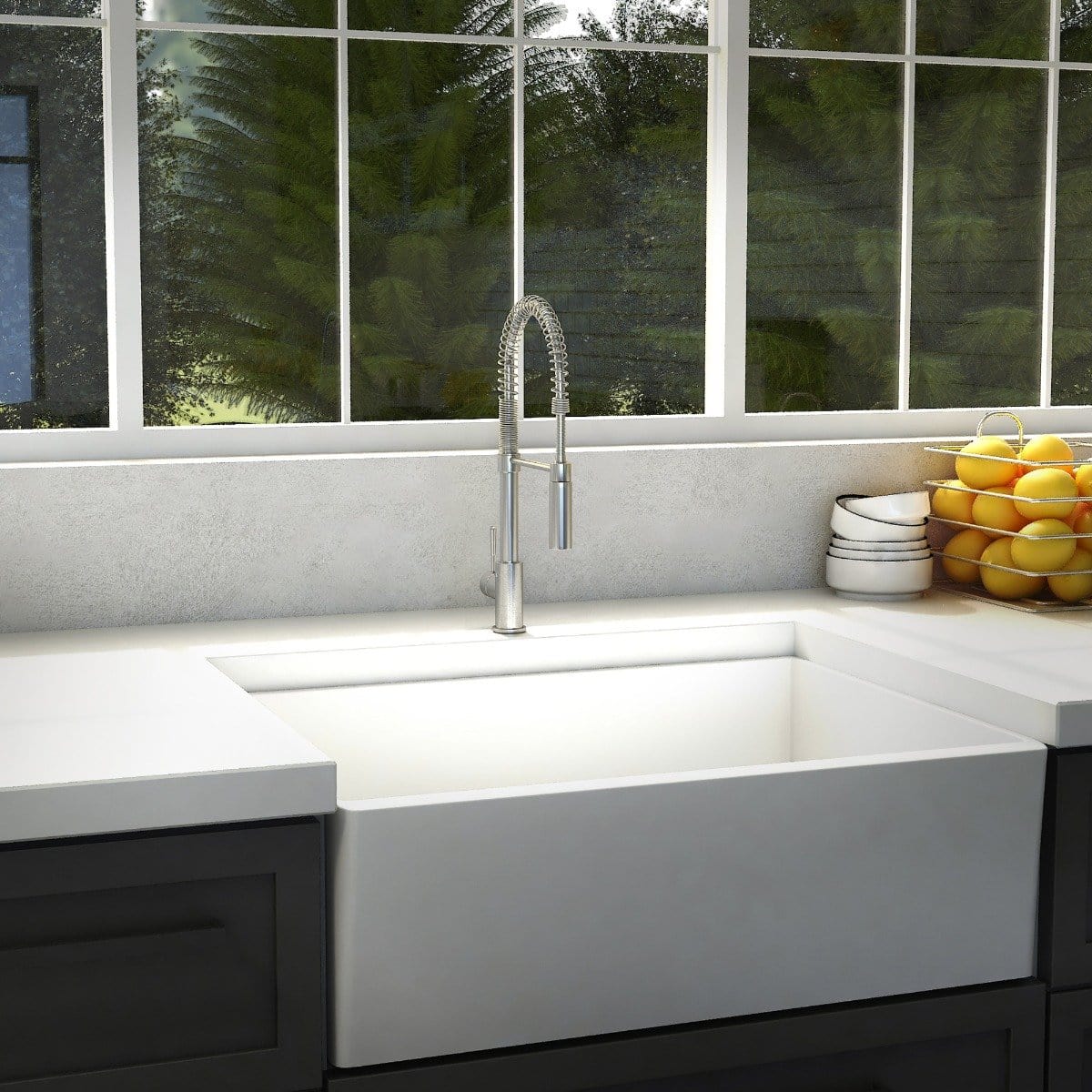 ZLINE Sierra Kitchen Faucet installed above a modern farmhouse sink with fresh lemons in the background.