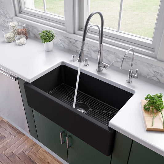 ALFI 33" Black Matte Reversible Smooth / Fluted Single Bowl Fireclay Farm Sink AB3318HS-BM in a modern kitchen setting.