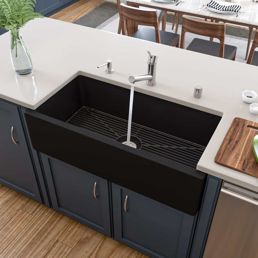 ALFI 36" Black Matte Reversible Smooth / Fluted Single Bowl Fireclay Farm Sink AB3618HS-BM installed in a modern kitchen.