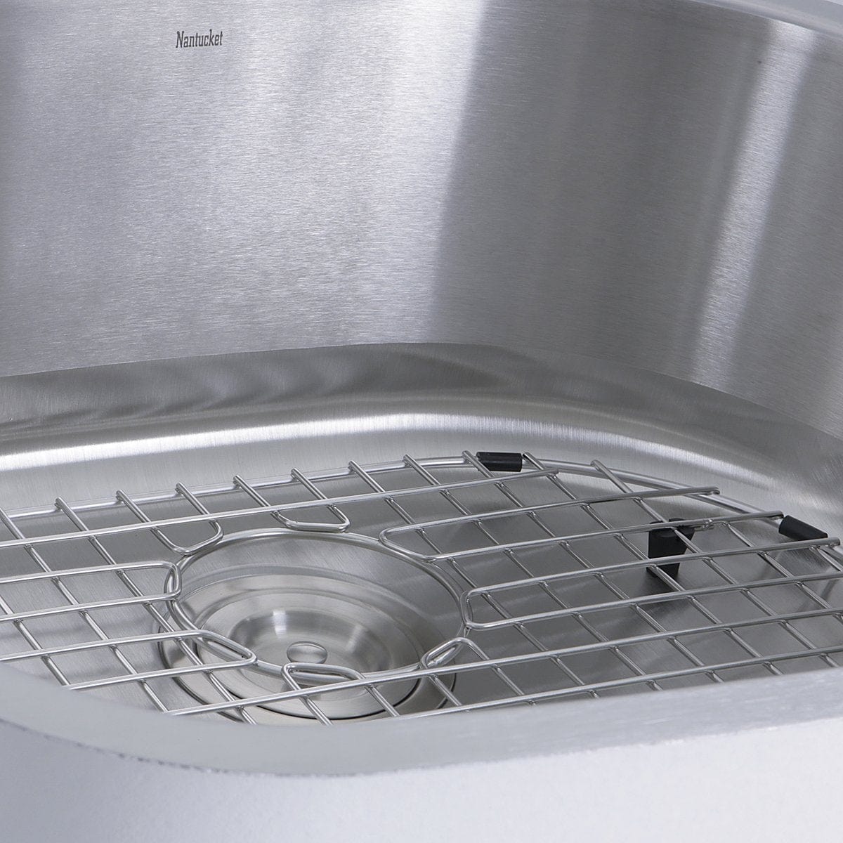 Nantucket Sconset 23" D-Bowl Undermount Stainless Steel Kitchen Sink, 16 Gauge - NS03i-16 with a grid for optimal drainage.