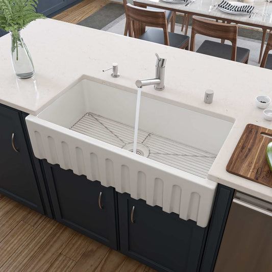 ALFI 36" White Reversible Smooth / Fluted Single Bowl Fireclay Farm Sink AB3618HS-W installed in a modern kitchen.