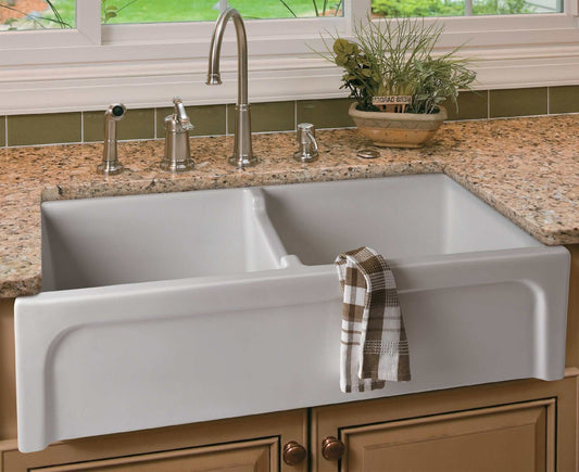 ALFI 39" Arched Thick Wall Fireclay Double Bowl Farm Sink AB3918ARCH-W on a granite countertop with faucet and towel.