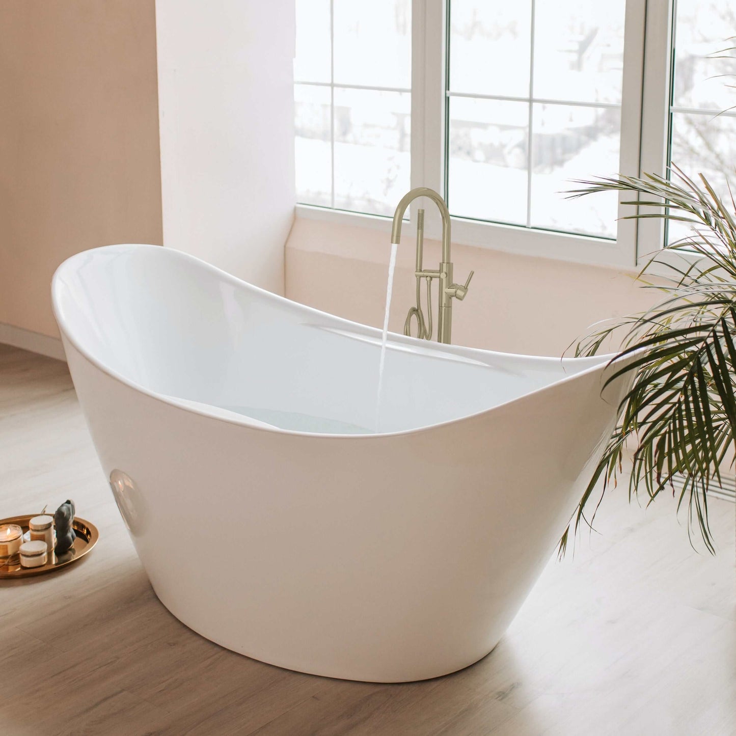 ZLINE Emerald Bay Bath Tub Filler in a modern bathroom setting with a view and tropical plant.