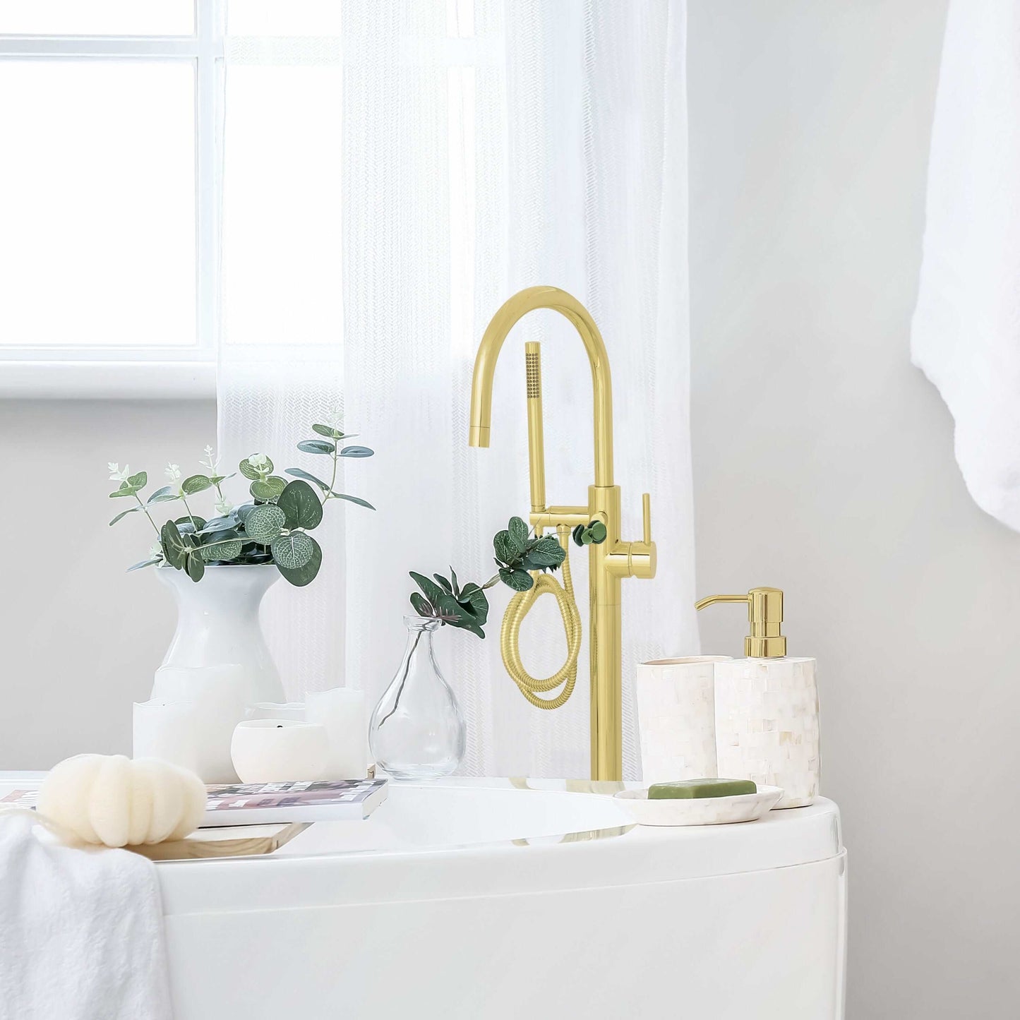ZLINE Emerald Bay Bath Tub Filler in luxurious bathroom setting with gold accents and elegant decor.