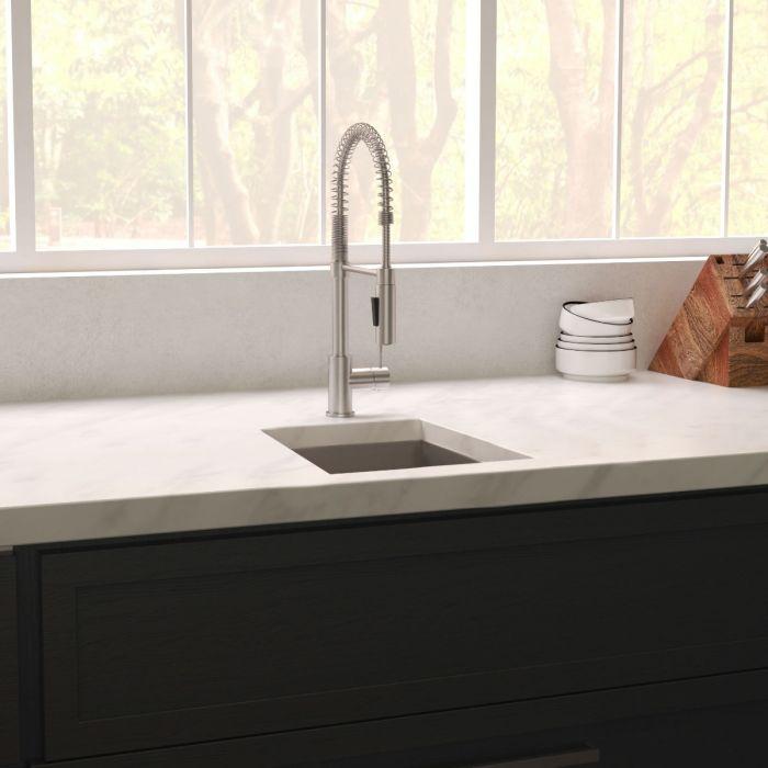 ZLINE Boreal 15" DuraSnow® Undermount Bar Sink SUS-15S installed with stainless steel faucet on elegant countertop.